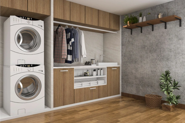 Modern laundry closet with cabinets, shelving, and integrated washer and dryer